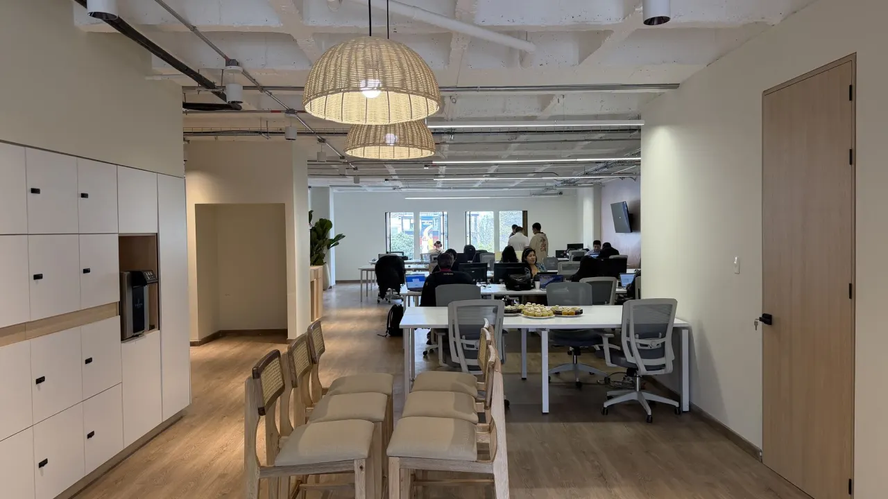 The open-plan Bogotá office with shared desks