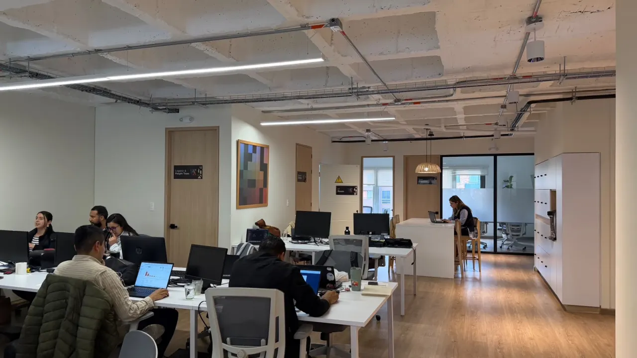The team at their desks in the Lahore office