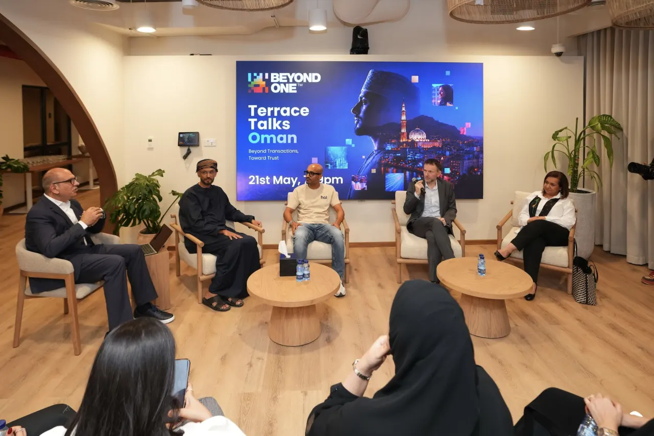 A panel talk in the Muscat office, with an audience seated around low tables